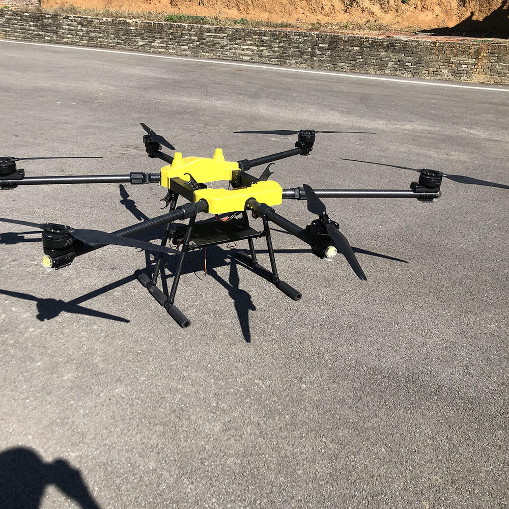 Two-camera cargo drone with bright yellow body and six-axis style frame, propellers out