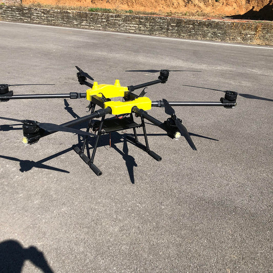 Two-camera cargo drone with bright yellow body and six-axis style frame, propellers out