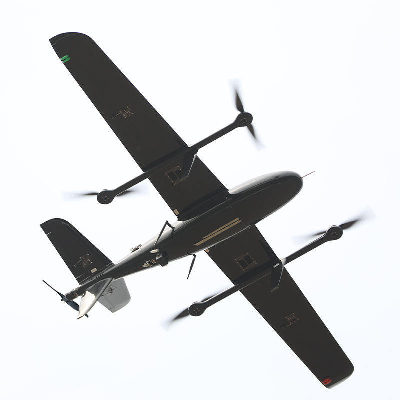 Black fixed-wing UAV with dual propellers, swept wings, and payload modules.